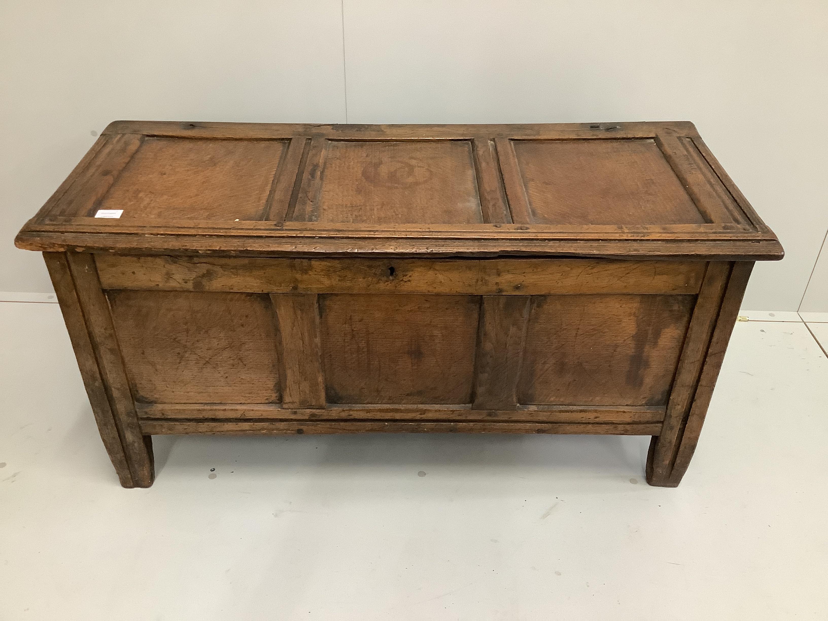 An early 18th century panelled oak coffer, length 121cm, depth 49cm, height 58cm